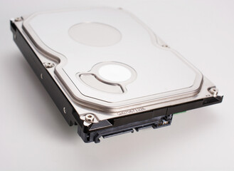 computer hard drive with SATA connector for ribbon cable connection. on white background.