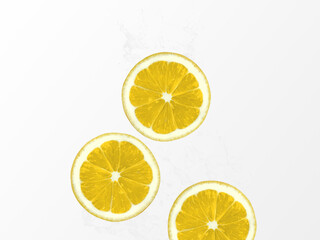 Lemon water Photo template with copy space Slices of juicy lemons dropped into water