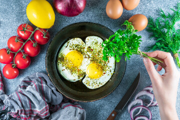 Tasty breakfast with fried egg on grey table
