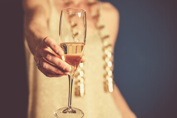 woman holding champagne glass New Year's eve party