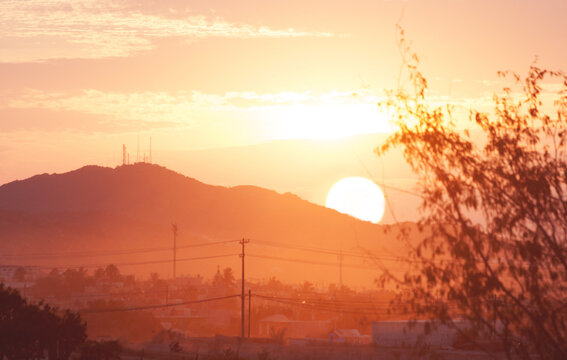Beautiful morning sunrise behind mountains