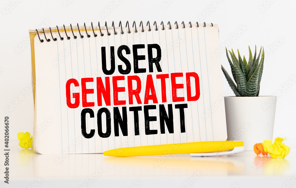 Poster business concept. top view of pen,glasses and notebook written with user generated content.