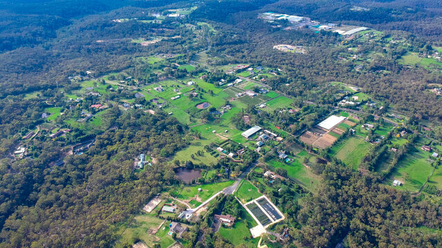 Panoramic Aerial view of Dural a country suburb in Sydney NSW Australia with lush green trees and grass 