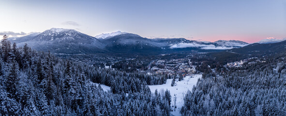 Aerial view of Whistler Village and ski runs at sunset.