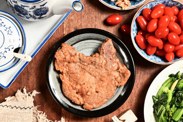 Delicious juicy pork chop on the plate     