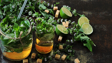 Fresh homemade mojito cocktail. Mint leaves, lime and brown sugar.