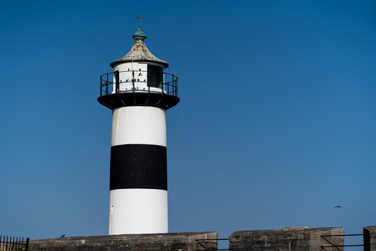 Lighthouse with white and blue stripes
