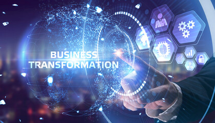 The concept of business, technology, the Internet and the network. A young entrepreneur working on a virtual screen of the future and sees the inscription: Business transformation