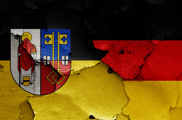flags of Krefeld and Germany painted on cracked wall