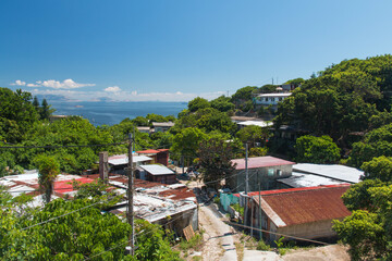 A view of rural houses on a clear sky background