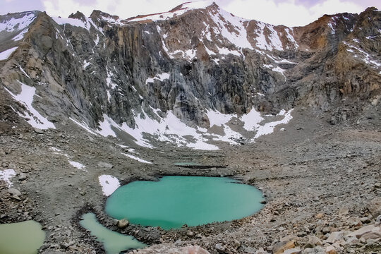 Gauri Kund, a tiny glittering lake surrounded by steep mountain peaks on the Tibetan Plateau, at an altitude of 5608 meters above sea level. This lake is sacred to Hindus, Buddhists and Jains alike. 