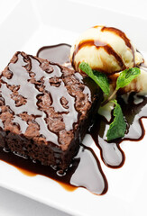 vegan chocolate brownie dessert with dairy-free vanilla ice cream