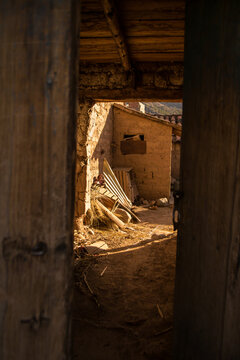Entering a chicheria in Cusco, in the Checacupe town. Captured in 2018.