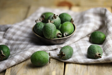 Fresh feijoa fruits in a bowl.
