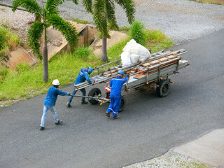 A contractor working in a petrochemical plant involved in setting up scaffolding.