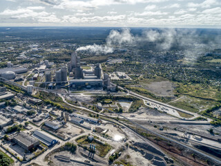 Fototapeta premium Large plant, aerial view. Fuming factory chimney