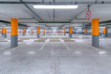 Large underground parking for cars. - obrazy, fototapety, plakaty