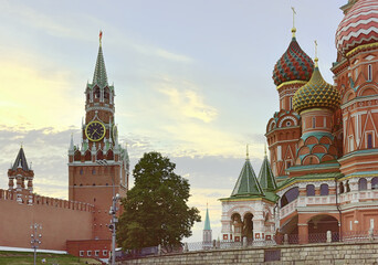 Moscow Kremlin and St. Basil's Cathedral on red square. Spasskaya tower, medieval Russian architecture, crosses on domes, beautiful decor. Brick architecture of the XV-XVII century, a UNESCO monument