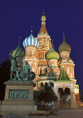 St. Basil's Cathedral with a monument to Minin and Pozharsky on red square in the night illumination. Monument to the heroes of the liberation war of 1612