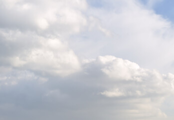 Obraz premium The clouds in the sky. White fluffy clouds on a light background