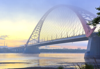 Naklejka premium Bugrinskij bridge in the morning mist. New road bridge on the banks of the great Siberian river Ob