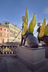 Gryphons of the Banks bridge on the Griboyedov canal. Four sculptures of mythical creatures with...