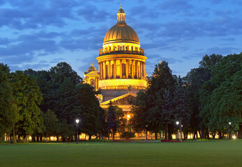 Night city. View of the dome of St. Isaac's Cathedral in the night lights against the blue predawn...