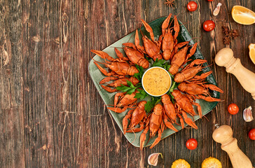 Crayfish-boiled river crayfish on a dark wooden background.Space for text.