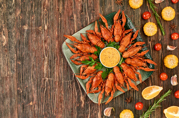 Crayfish-boiled river crayfish on a dark wooden background.Space for text.