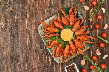 Crayfish-boiled river crayfish on a dark wooden background.Space for text.