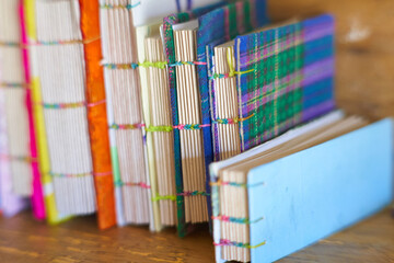 spine of notebooks with recycled materials. Fabric quadrille covers