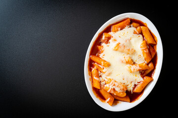 Korean rice cake in spicy Korean sauce with cheese, Cheese Tokpokki, Tteokbokki with Cheese