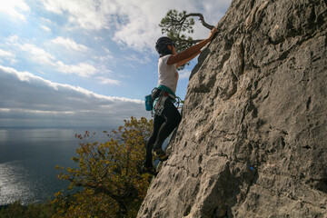 A young woman climbs in Crimea, Russia.