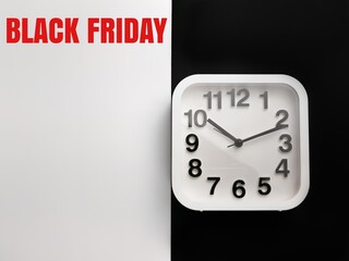 Phrase BLACK FRIDAY on black and white background with alarm clock. Thanks giving promotion advertising with copy space.