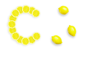 Lemon is a natural source of vitamin c . Alphabet letter C made from yellow lemons.