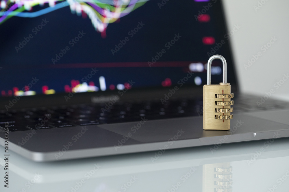 Poster a closeup shot of a lock on a computer keyboard - cyber safety concept