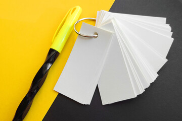 Blank sheets of Notepad are held together with a metal ring , mockup, pen and black yellow...