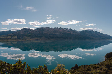 Obraz premium Amazing reflection of mountain peaks in the water of Lake Wakatipu. Glenorchy, New Zealand