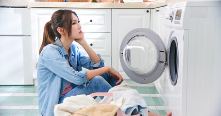 woman wash clothes frustratedly