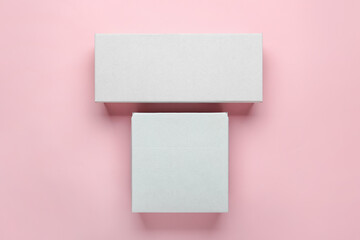 Obraz na płótnie Canvas Blank cardboard boxes on color background