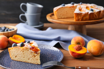 Plate with piece of tasty peach pie, closeup