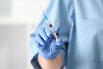 Female doctor with syringe, closeup