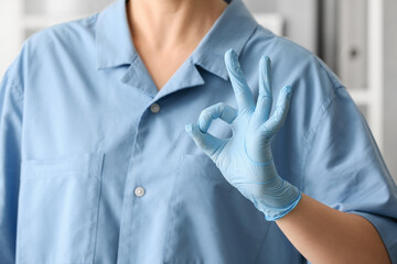 Female doctor showing OK, closeup