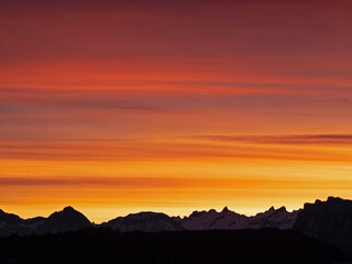 Burning sky over the Swiss Alps before sunrise 