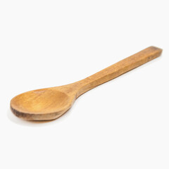 Small used wooden spoon isolated on white background