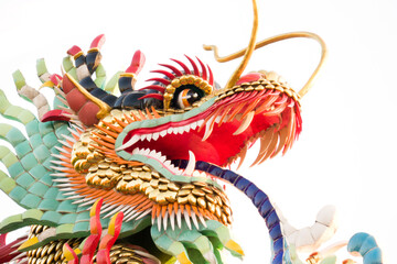 Closeup Dragon statue in Chinese Temple isolated on white background