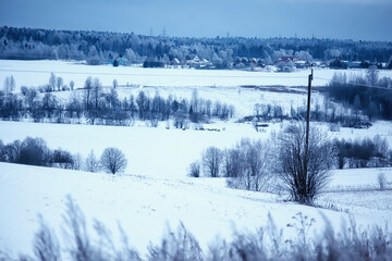 Russian village in winter, landscape in January snowfall, village houses