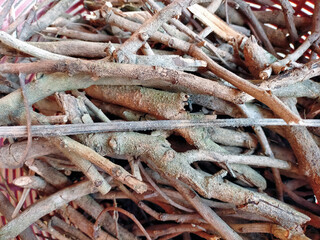 close up of small dried branches rusty wood sticks many small branches twigs in the basket.