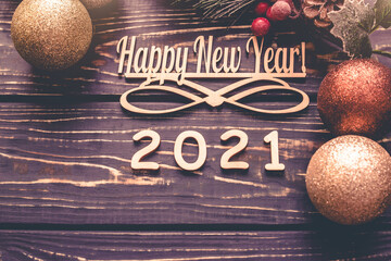 Happy new year 2021 on wooden brown background