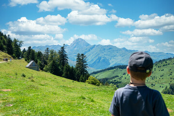 boy looking Pic du Midi de Bigorre in the french Pyrenees mountains